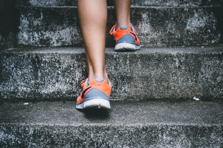 running shoes on stairs - bold claims - benefits of movement