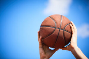 touch - man holding a basketball
